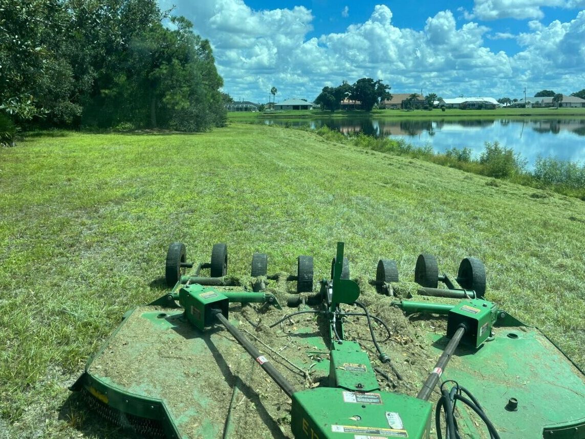 Field Mowing in Action by Reynolds Mowing, In.c Venice Florida